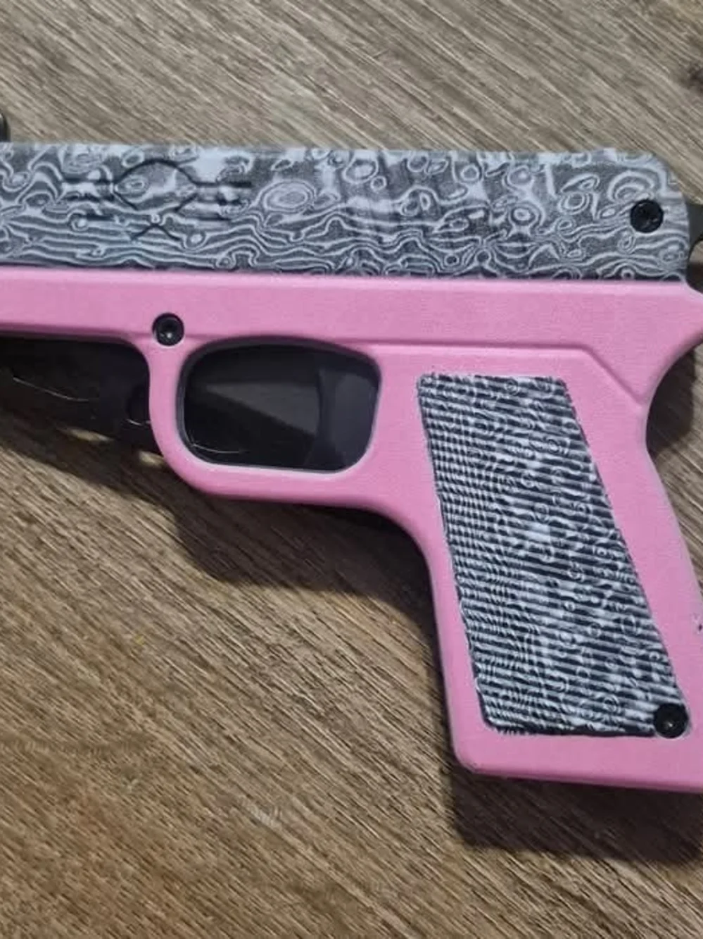 Man Or Woman Pink Pistol Frame with Damascus-Pattern Slide Accent